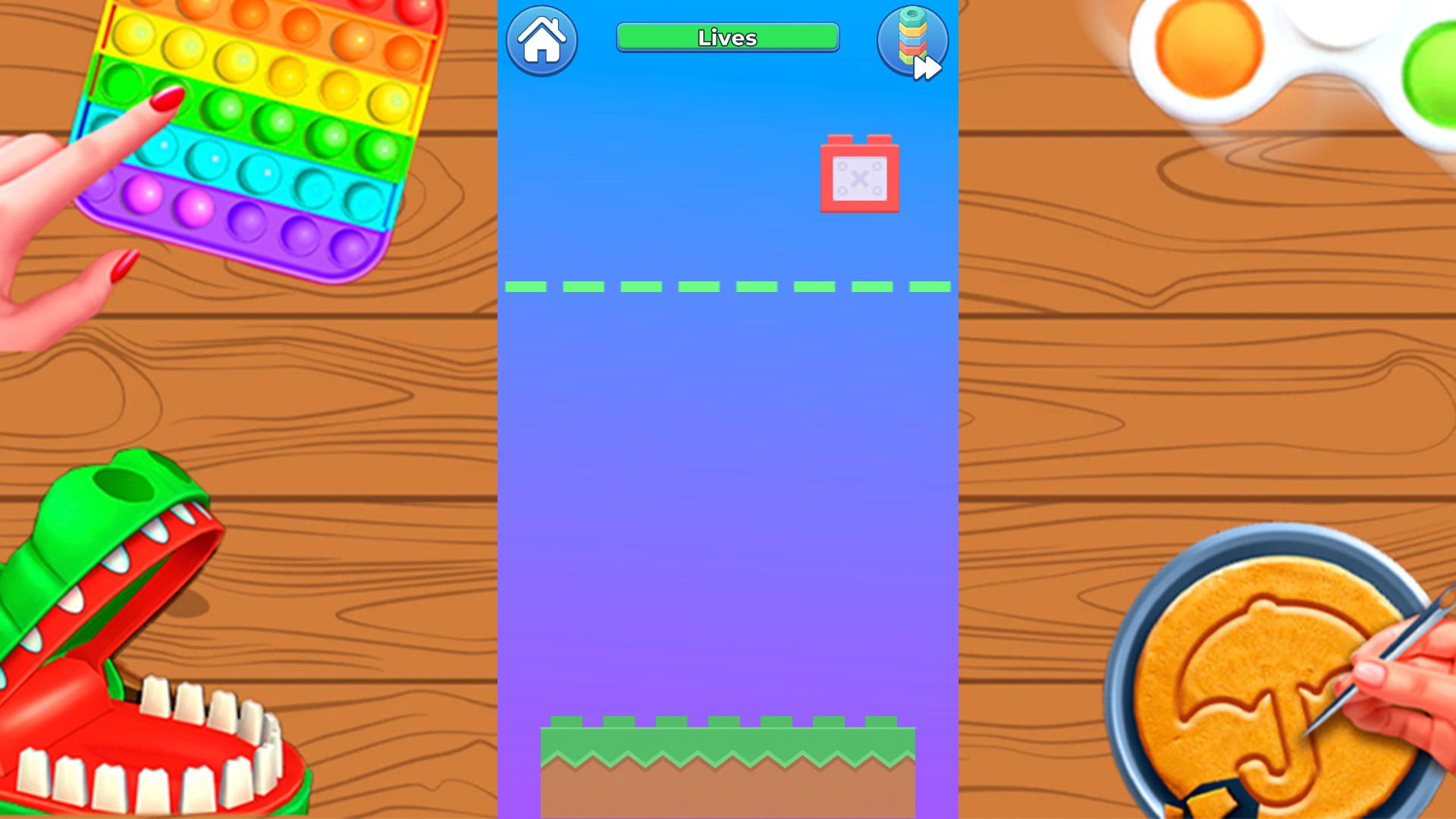 A red block moves above the green landing base in Tower, with a full Lives bar.