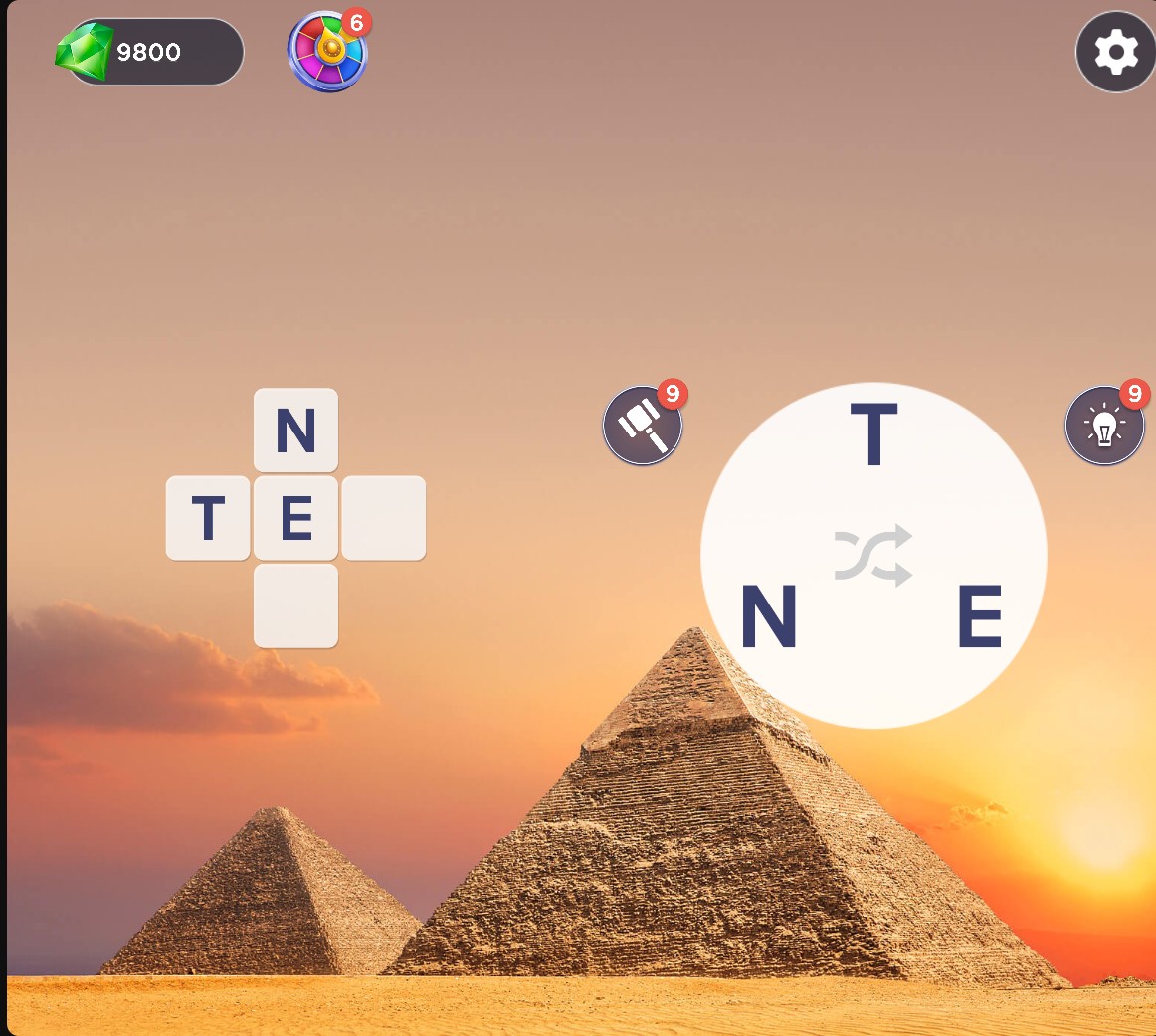 Words of Wonders with T revealed in the selected left tile, nine hammer hints and nine bulb hints remaining.